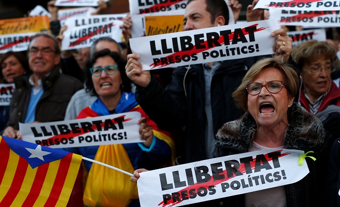 Protesters take part in a pro-independence demonstration asking for the release of jailed Catalan activists in Barcelona.