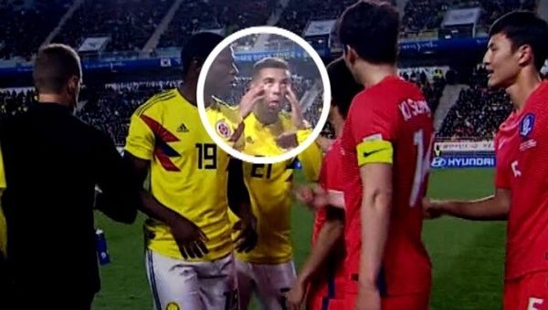 Cardona is seen making a racist gesture with his hands during the match against South Korea.