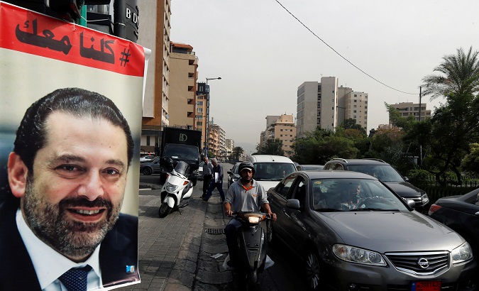Cars pass next to a poster depicting Saad al-Hariri, who has resigned as Lebanon's prime minister, in Beirut, Lebanon,, Lebanon, November 13, 2017