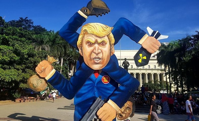 The 13-foot Trump effigy that served as a “fascist spinner” before being burnt by protesters in the Philippines.