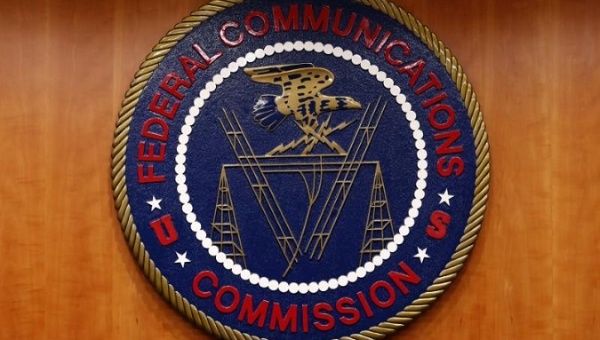 The Federal Communications Commission, FCC, logo is seen before the FCC Net Neutrality hearing in Washington February 26, 2015.