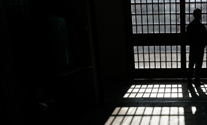 An inmate is seen standing in a prison cell in this file photo.