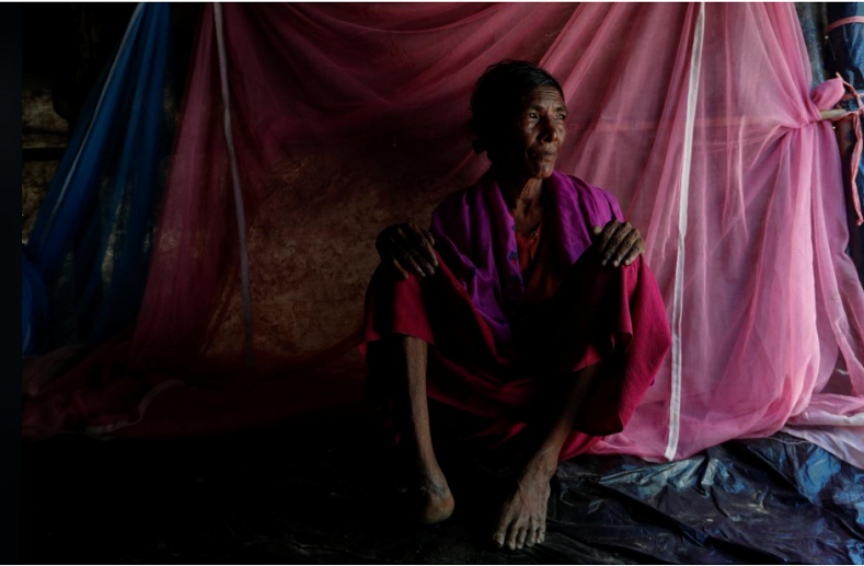Kalabarow, 50, at Leda refugee camp in Bangladesh. Her husband, daughter and one son were killed when soldiers fired on Kalabarow’s village in Maungdaw. The 50-year-old was hit in her right foot. For several hours, she lay where she fell, pretending to be dead, before a grandson found her. During their 11-day journey to Bangladesh, a village doctor amputated her infected foot and four men carried her on a stretcher made of bamboo and a bedsheet. “As we walked through the forest, we saw burnt villages and dead bodies. I thought we would never be safe,” she said.