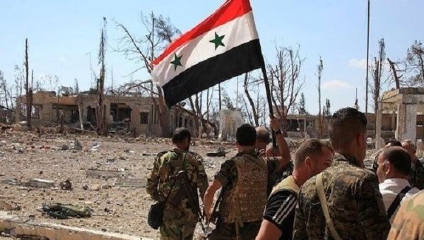 Syrian Arab Army members patrol a liberated area.