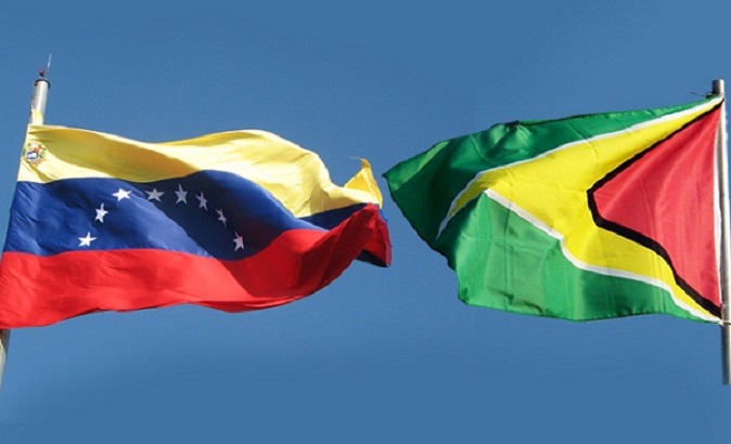 The flags of Venezuela and Guyana.