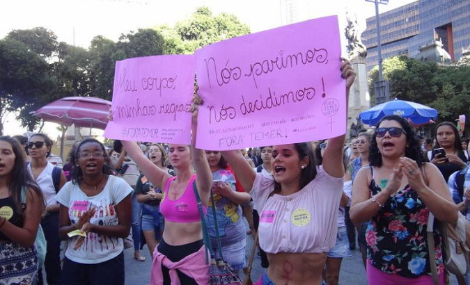 Women’s rights activists protest against a bill to ban abortion in Rio de Janeiro.