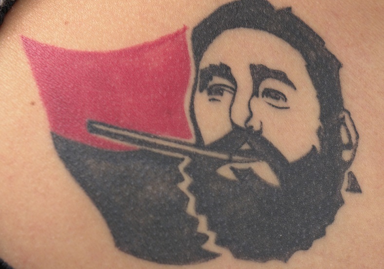 A tattoo featuring Fidel and the flag of the 26th of July Movement that he founded.