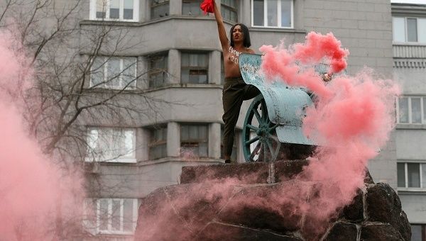 An activist in the feminist movement FEMEN protests against the political activities of President Petro Poroshenko and the Ukrainian government in Kiev.