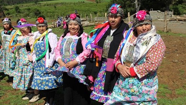 Female members of Argentina's Indigenous Mapuche community wearing traditional dress.