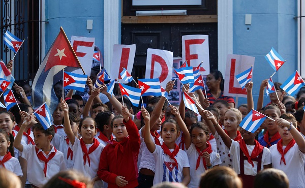 Schoolchildren commemorate the first anniversary of the death of Cuba's late president Fidel Castro in Havana.