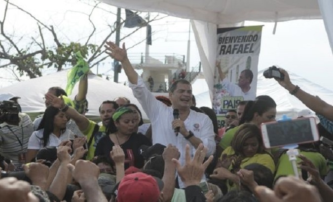 Former Ecuadorean President Rafael Correa speaks to welcomers.