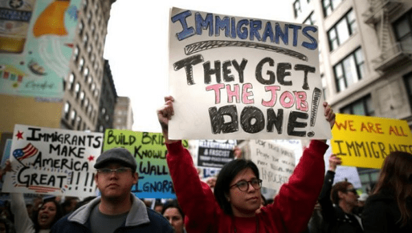 People participate in a protest march calling for human rights and dignity for immigrants, in Los Angeles, February 18, 2017