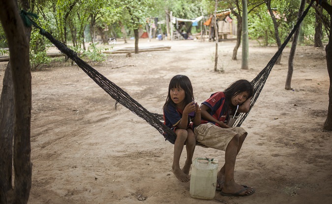 Two Indigenous Ayoreo Totobiegosode girls resting in the Chaidi community, in Alto Paraguay, December 2014.