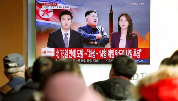  People watch a TV broadcasting a news report on North Korea firing what appeared to be an intercontinental ballistic missile (ICBM) that landed close to Japan, in Seoul, South Korea, November 29, 2017.