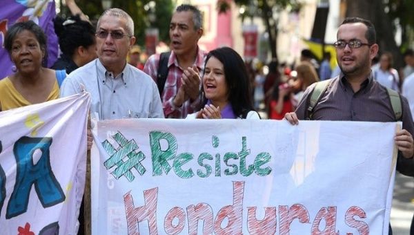 Demonstrators gathered on Tuesday at Plaza Bolivar in Caracas, Venezuela, to denounce the silence over the situation in Honduras.