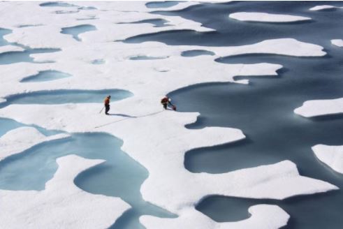 The crew of the U.S. Coast Guard Cutter Healy, in the midst of their ICESCAPE mission, retrieves supplies in the Arctic Ocean in this July 12, 2011 NASA handout photo.