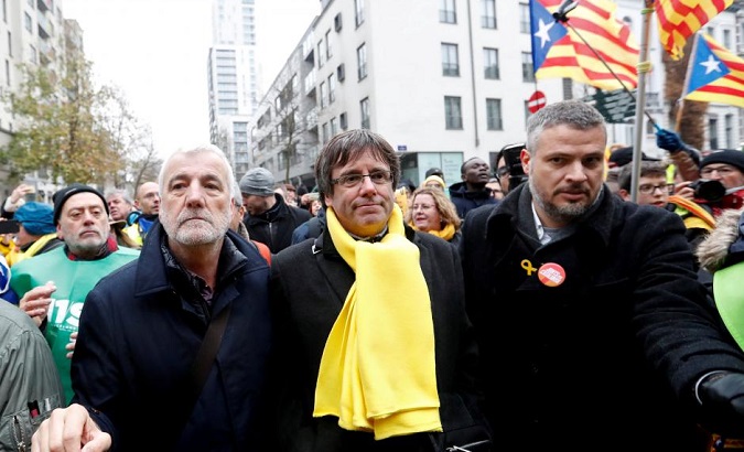 Ousted Catalan leader Carles Puigdemont takes part in a pro-independence rally in Brussels, Belgium.