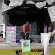 A man helps with the clean-up effort in the wake of the 7.8 earthquake that struck Ecuador in 2016.