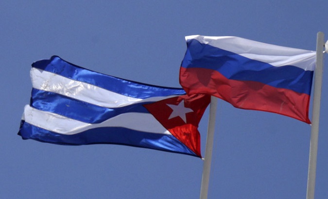 The Flag of Cuba (L) flies next to the Flag of Russia (R).
