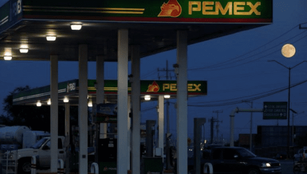 Clients get fuel at a gas station of state-owned company Petroleos Mexicanos (Pemex), in Ciudad Juarez, Mexico October 4, 2017.