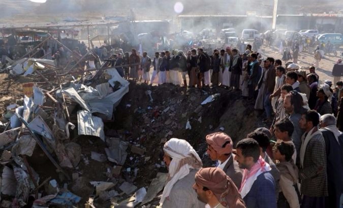 People gather at the site of an airstrike in Yemen's northwestern city of Sa'dah in November.