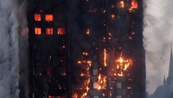 Flames and smoke engulf the Grenfell Tower in west London on June 14, 2017