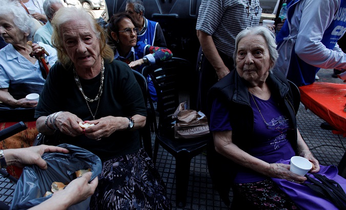 Argentine retirees protest with bread and water against the reforms of the government of pensions and tax, in front of National Congress of Argentina, in Buenos Aires, Argentina December 20 2017