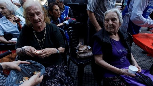 Argentine retirees protest with bread and water against the reforms of the government of pensions and tax, in front of National Congress of Argentina, in Buenos Aires, Argentina December 20 2017