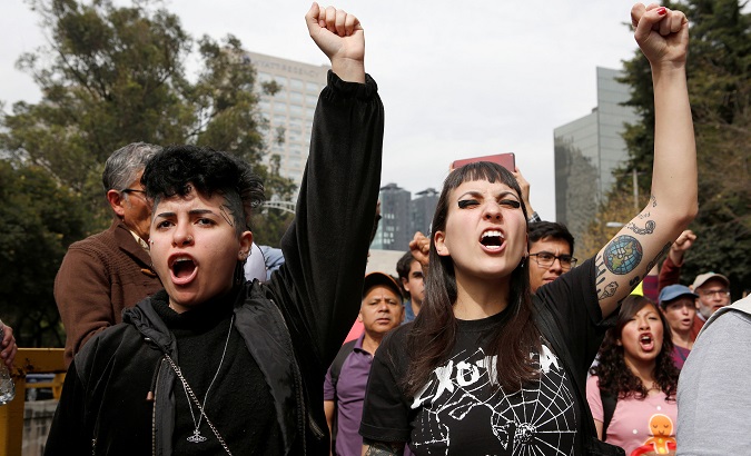 Activists protest against law that militarizes crime fighting, outside Los Pinos Presidential Residence in Mexico City.
