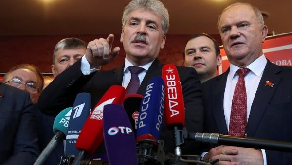 Pavel Grudinin, head of the Lenin State Farm and Communist Party presidential nominee talks to the media as he stands next to Russia's Communist Party leader Gennady Zyuganov after a party congress in Snegiri outside Moscow, Russia, December 23, 2017.