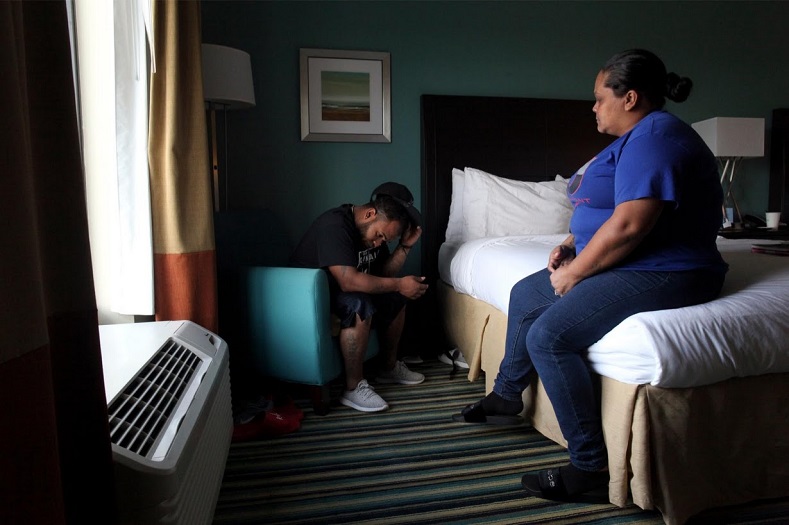 Miguel Alvarez and his wife Liz Vazquez arrived to Florida with their two sons after Hurricane Maria. They now live in a hotel room which provides a temporary housing for displaced Puerto Ricans.