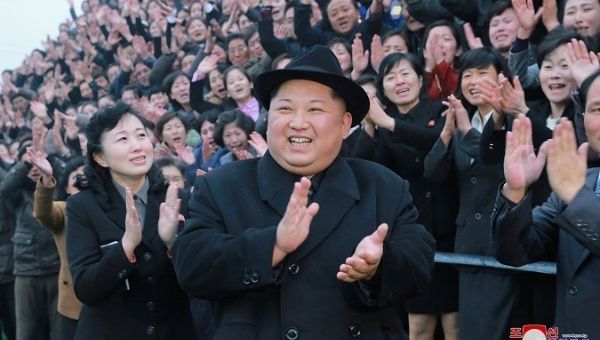 North Korean leader Kim Jong Un reacts as people applaud during his visit to the newly-remodeled Pyongyang Teacher Training College.