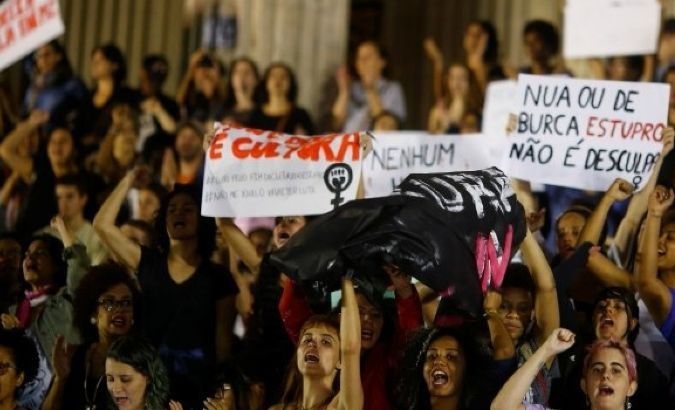 Demonstrators attend a protest against rape and violence against women in Rio de Janeiro, Brazil.