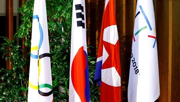 Flags of the International Olympic Committee, the Republic of Korea, the Democratic People's Republic of Korea and the PyeongChang 2018 Organising Committee.