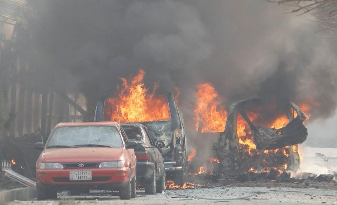Cars on fire follow a blast near Save the Children in Jalalabad on Jan. 24, 2018.