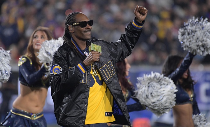 Music artist Snoop Dogg performs during halftime in the NFC Wild Card playoff football game between Atlanta Falcons and Los Angeles Rams.
