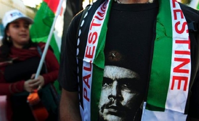 Che Guevara's face is seen alongside Palestine flags at a solidarity rally in Nicaragua.
