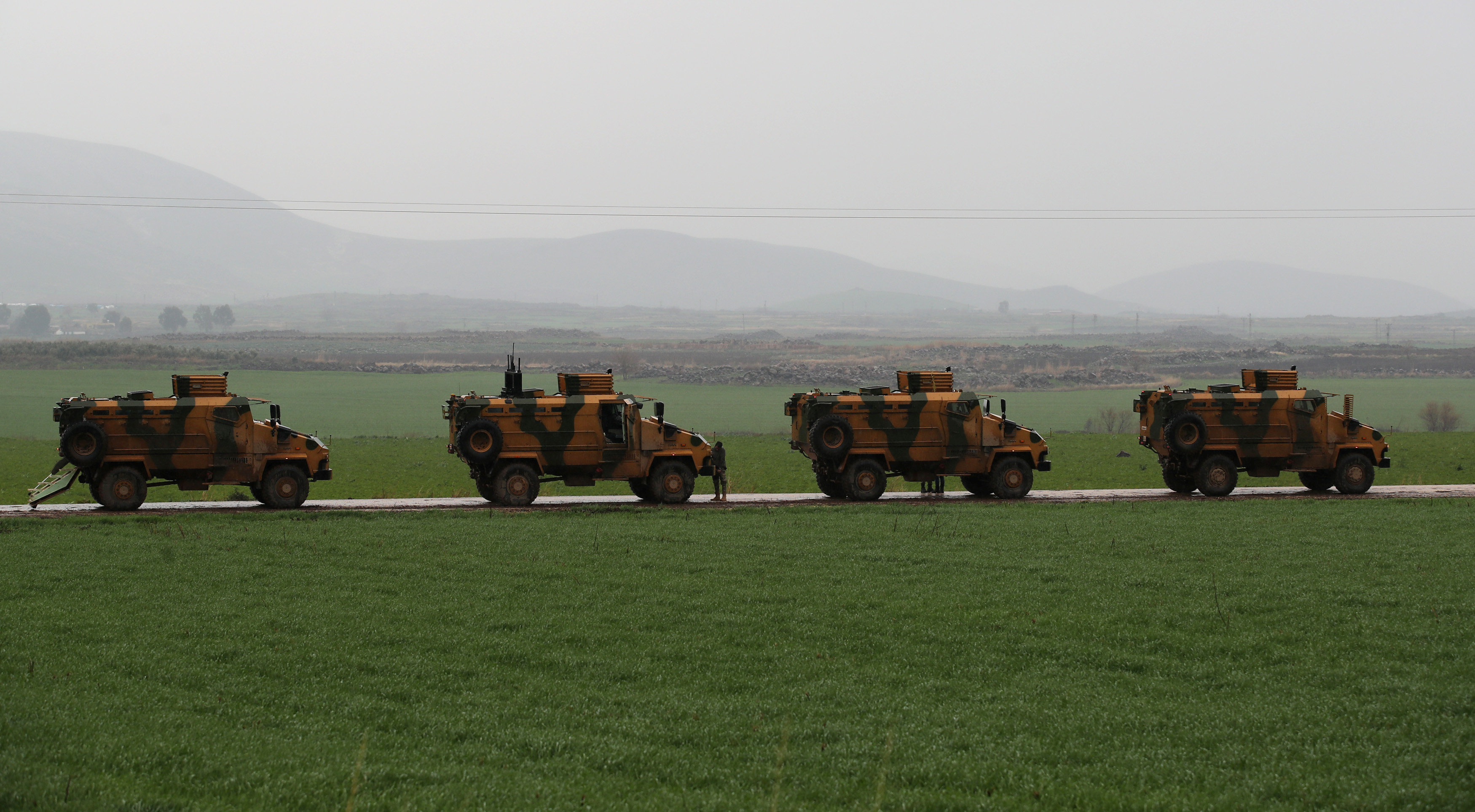 Turkish army vehicles are pictured near the Turkish-Syrian border in Hatay province, Turkey January 23, 2018.