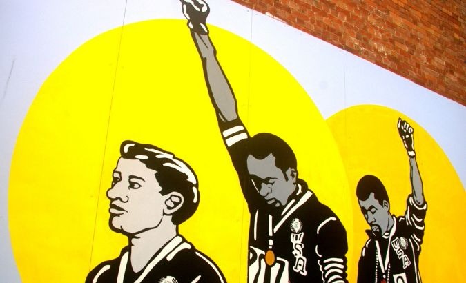 Mural of the raised fist salute of Tommie Smith and John Carlos at the 1968 Olympics.