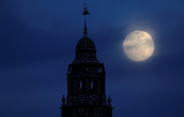A blue moon rises over Balboa Park's California Tower in San Diego, California, in the United States, January 30.