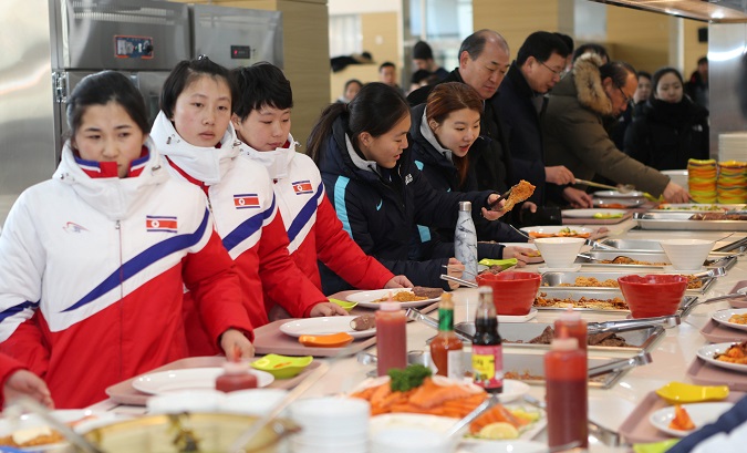 Women's ice hockey players from North and South Korea dine together during their Winter Olympics 2018 training in Jincheon, South Korea.