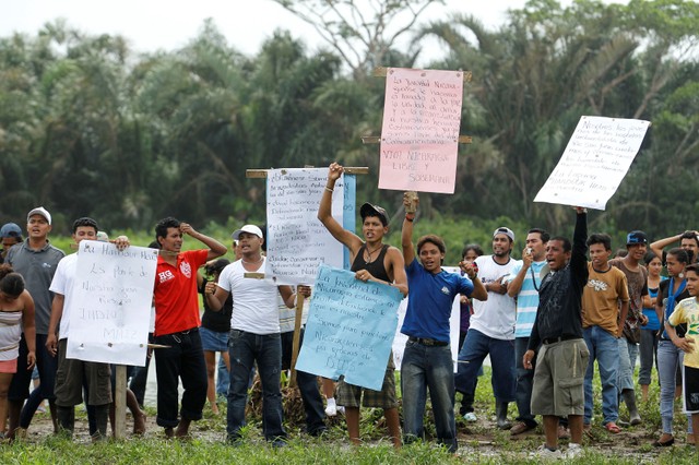 Nicaraguan protesters stake their claim to Isla Portillos, a restricted swath of land near Costa Rica and Nicaragua's border, as a team of Costa Rican environment experts and representatives of the Ramsar Convention on Wetlands inspect the area for environmental damage April 5, 2011.