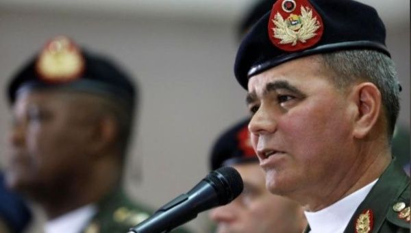 Flanked by military top brass, Venezuelan Defense Minister Vladimir Padrino rejects U.S. threats of a coup to oust President Maduro.