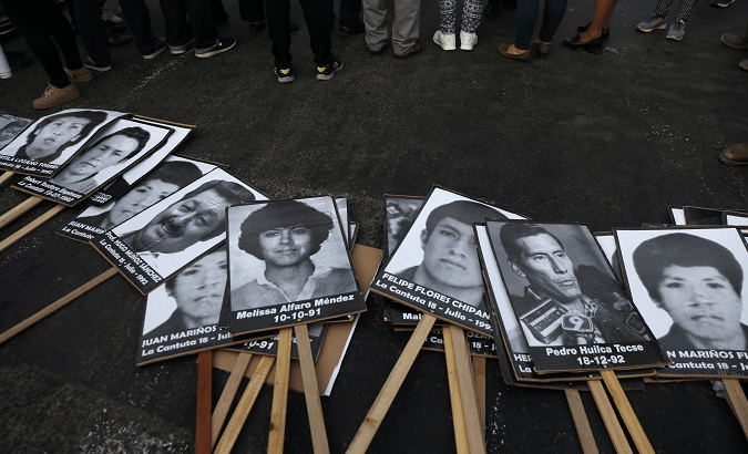 Photos of the victims of the guerrilla conflict which raged during the 1980s and 1990s are displayed at a protest against Fujimori's pardon in Lima, Peru.