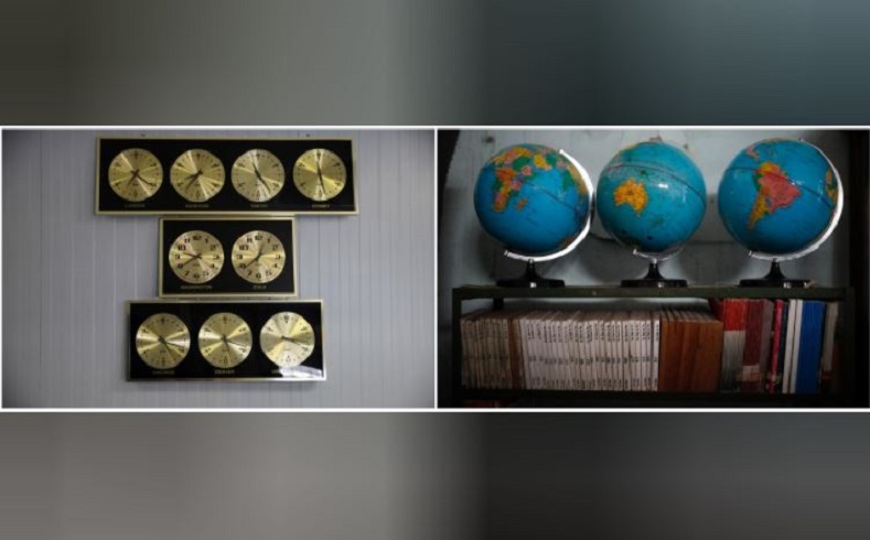 Clocks keep time, measuring the hour of various capitals around the world along the wall of the naval base. Outdated books and well-worn globes line the shelves of a local school in Guantanamo Bay.