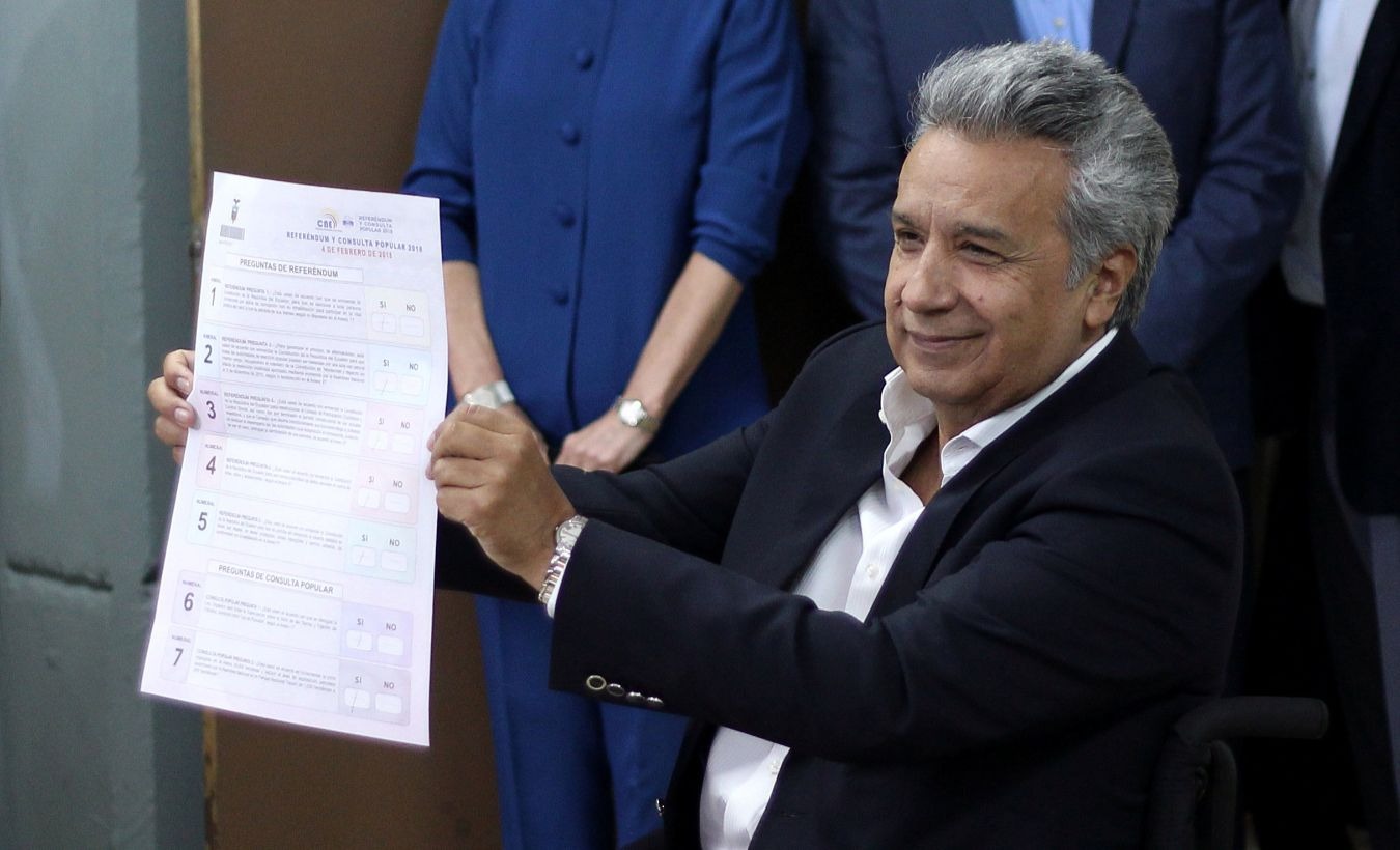 Ecuador's President Lenin Moreno shows his ballot before casting his vote in a referendum on whether to prevent unlimited presidential re-election, in Quito, Ecuador February 4, 2018.