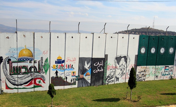 A wall decorated with graffiti is seen at Kfar Kila village near the Lebanese-Israeli border, southern Lebanon.