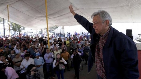 Andres Manuel Lopez Obrador, leader of the National Regeneration Movement party, waves after giving a speech to supporters in Tlapanoloya, Mexico.