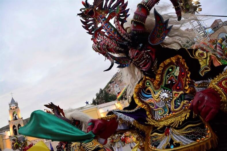 The Diablada is a traditional Bolivian dance that gets its name from the masks and costumes used by the dancer. The dance shows devotion to the Virgen del Socavon (Sinkhole Virgin) and honors the cult to the Uncle of the mine. 