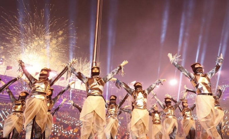 Performers dressed in traditional costume danced for the thousands of spectators attending the opening ceremony.